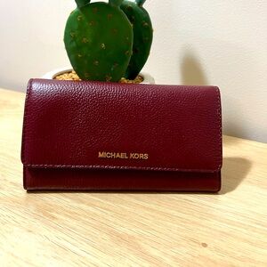 Like New! Beautiful Michael Kors tri-fold wallet, rich maroon pebbled leather